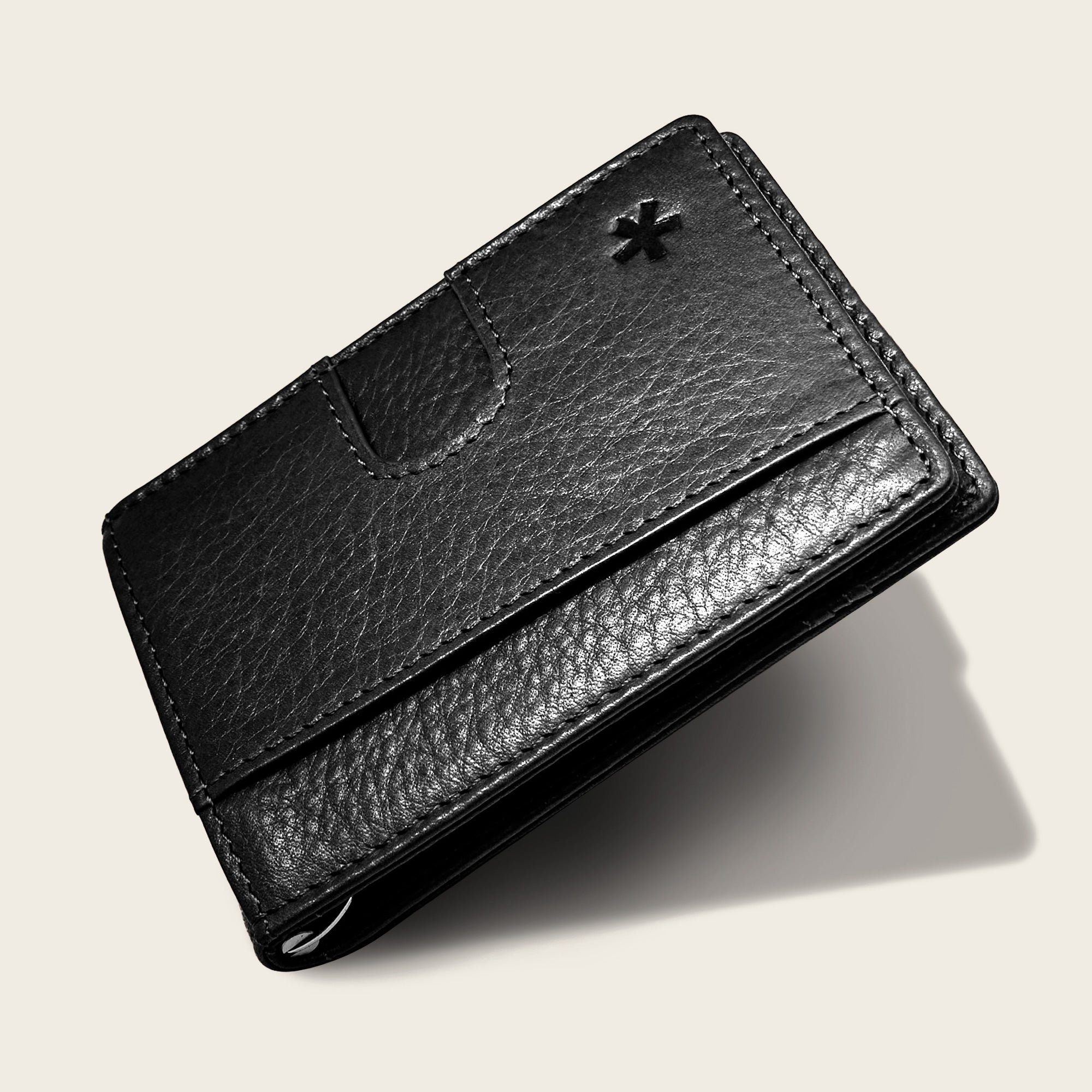 Origin Wallet — A bifold wallet made with ethically sourced Argentinian leather. Displayed in Onyx.