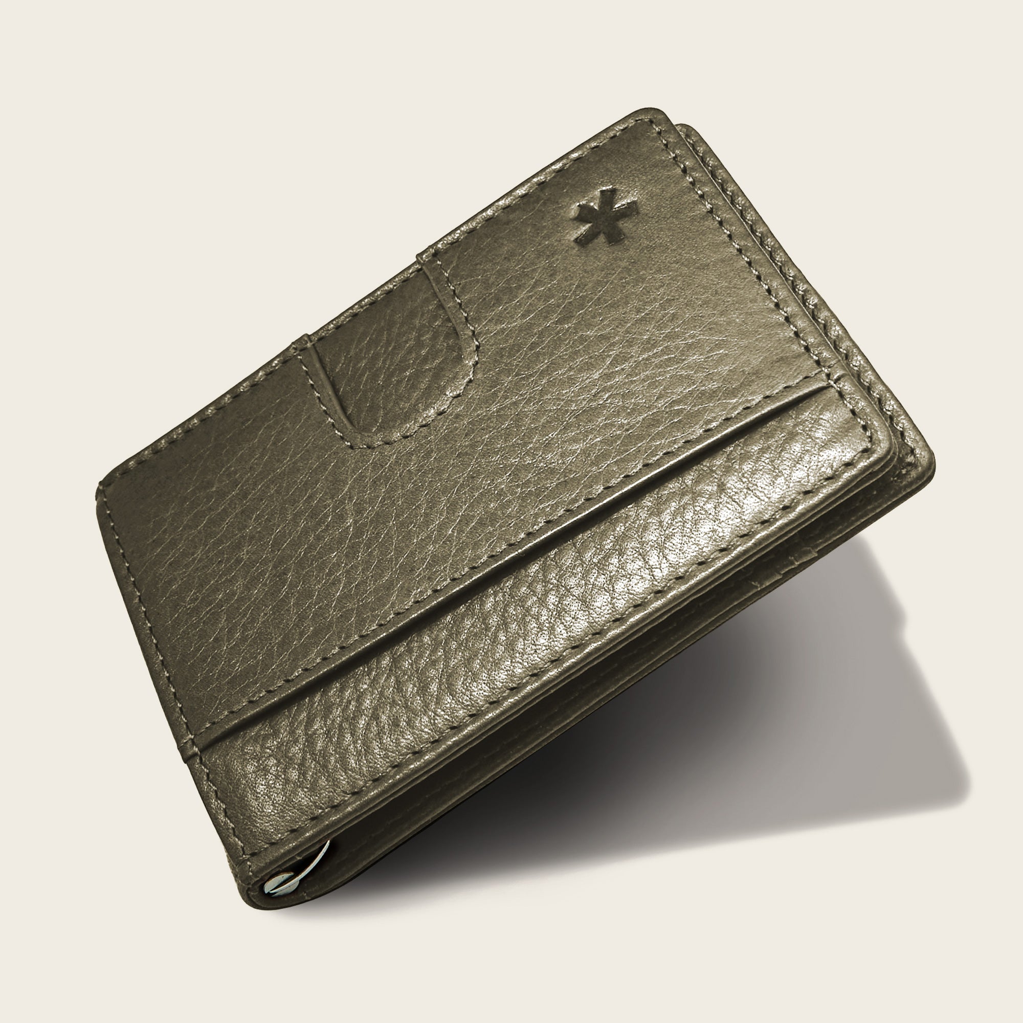 Origin Wallet — A bifold wallet made with ethically sourced Argentinian leather. Displayed in Moss.
