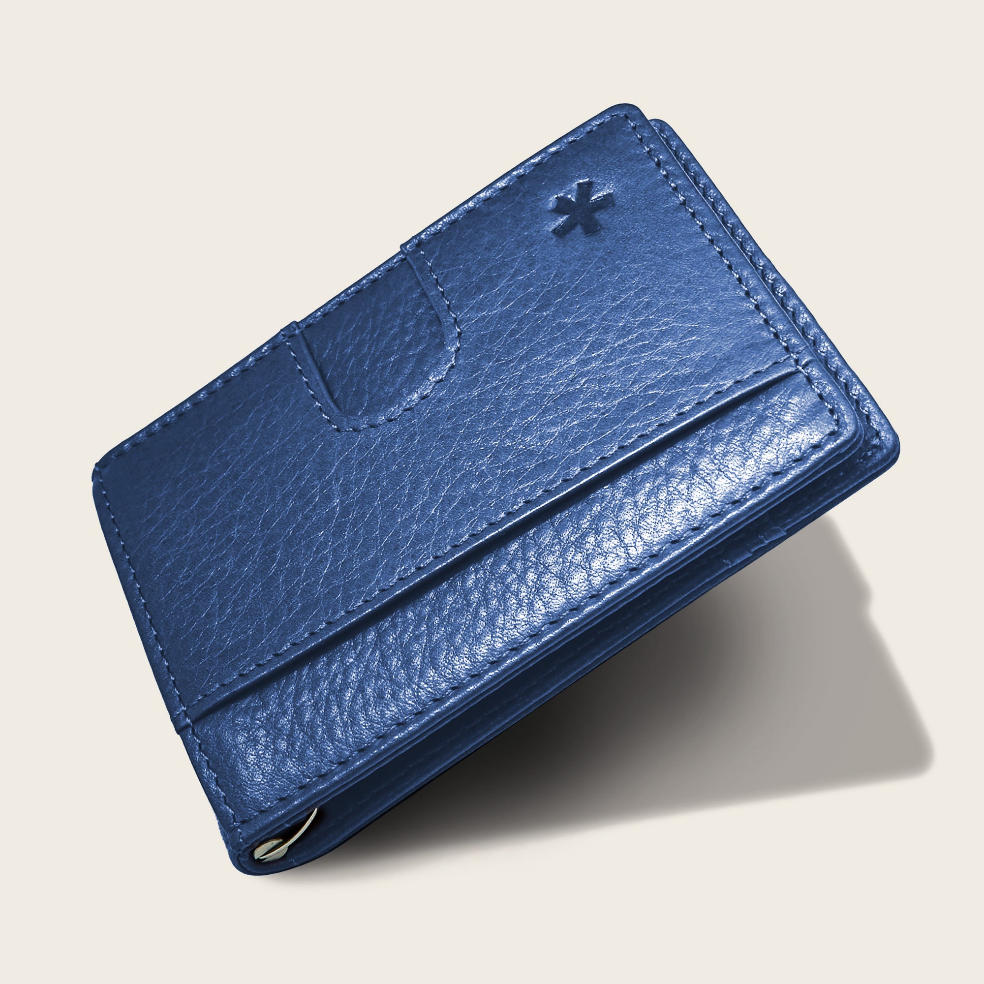 Origin Wallet — A bifold wallet made with ethically sourced Argentinian leather. Displayed in Cobalt.