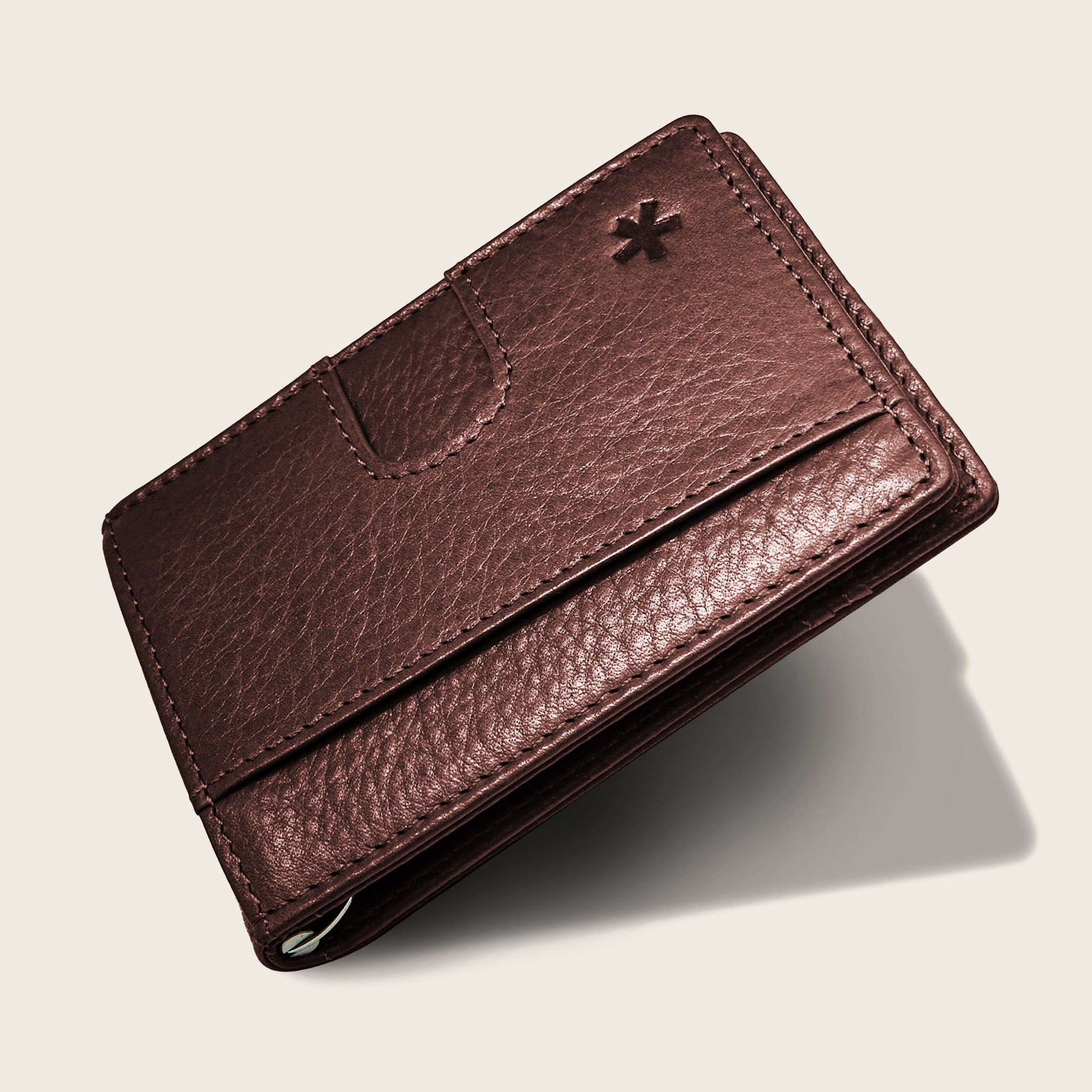 Origin Wallet — A bifold wallet made with ethically sourced Argentinian leather. Displayed in Walnut.