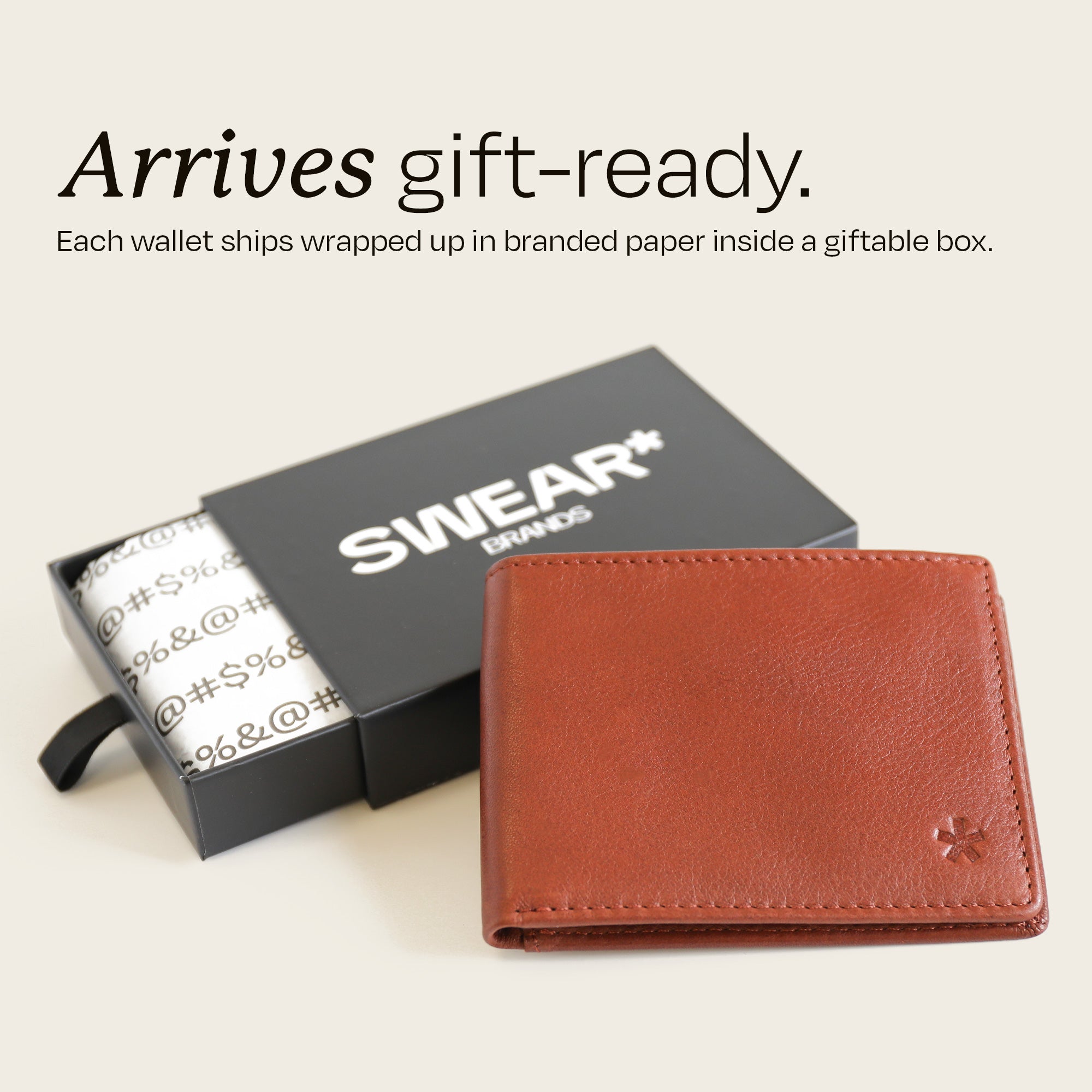 The Swear Brands Venture Wallet pictured in Acorn (light brown). Text reads: "Arrives gift-ready. Each wallet ships wrapped up in branded paper inside a giftable box."