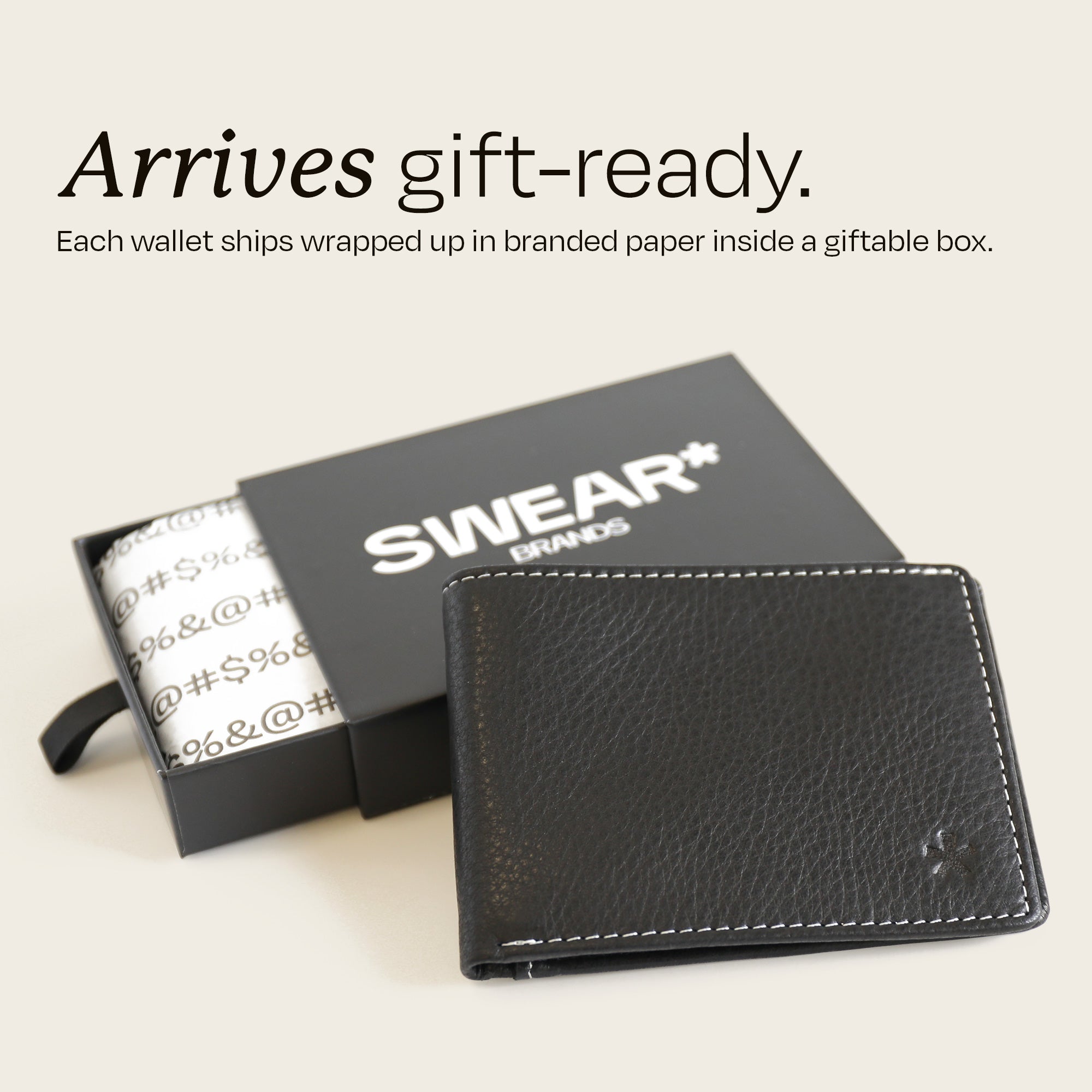 The Swear Brands Venture Wallet pictured in Onyx (black). Text reads: "Arrives gift-ready. Each wallet ships wrapped up in branded paper inside a giftable box."